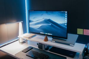 Minimalist office setup with purple glow